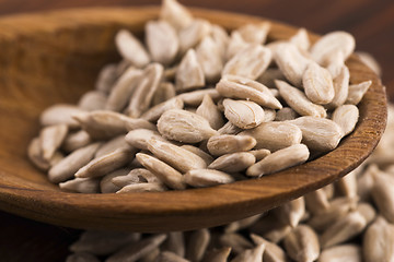 Image showing Sunflower seed with a wooden spoon