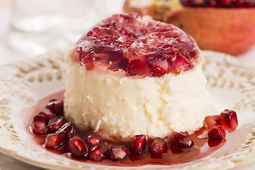 Image showing coconut panna cotta dessert with pomegranate