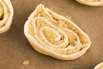 Image showing Puff pastry cookies with apple and cinnamon before baking