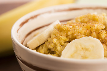 Image showing Fresh millet porridge with banana