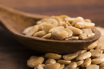 Image showing broad bean dry on wooden table