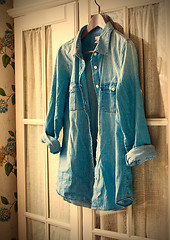 Image showing denim shirt on a hanger