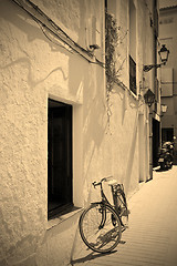 Image showing bicycle at a white wall