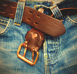 Image showing leather belt on old jeans