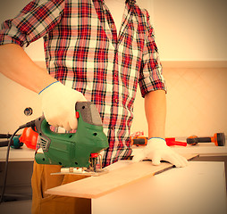 Image showing repairman with jigsaw