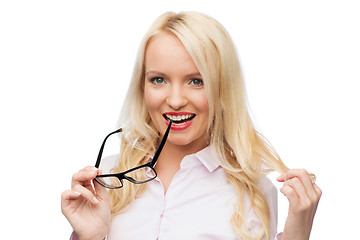 Image showing smiling businesswoman or secretary in office