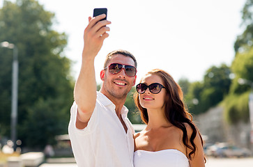 Image showing smiling couple in city