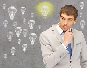 Image showing young businessman thinking