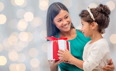 Image showing happy mother and daughter with gift box