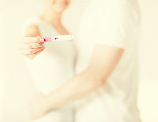 Image showing woman and man hands with pregnancy test