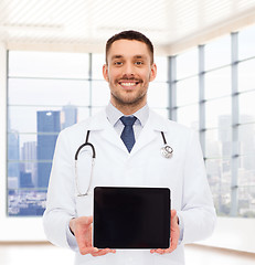 Image showing smiling male doctor with tablet pc