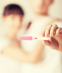 Image showing woman and man hands with pregnancy test