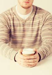 Image showing man hand holding take away coffee cup