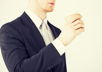 Image showing man hand holding take away coffee