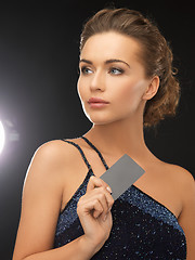 Image showing woman in evening dress with plastic card