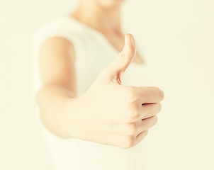 Image showing woman showing thumbs up