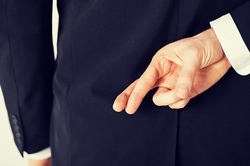 Image showing man with crossed fingers