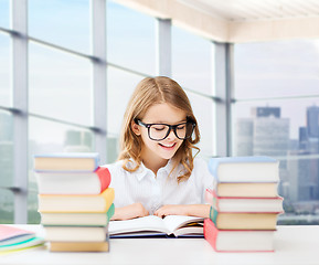 Image showing happy student girl reading book at school