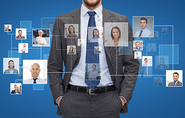 Image showing close up of businessman over icons with contacts