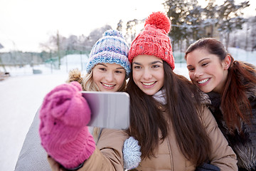 Image showing happy teenage girls taking selfie with smartphone