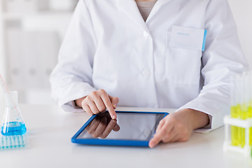 Image showing close up of scientist with tablet pc in lab