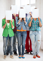 Image showing students covering faces with blank papers