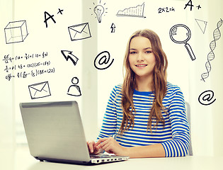 Image showing smiling teenage gitl with laptop computer at home