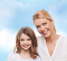 Image showing smiling mother and little girl