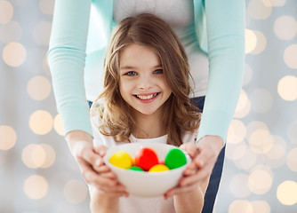 Image showing close up of happy family holding easter eggs