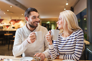 Image showing happy couple meeting and drinking tea or coffee