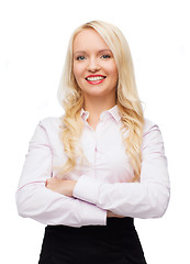 Image showing smiling businesswoman or secretary in office