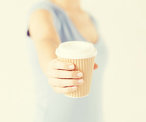 Image showing woman hand holding take away coffee cup