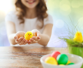 Image showing close up of girl holding easter chicken toy