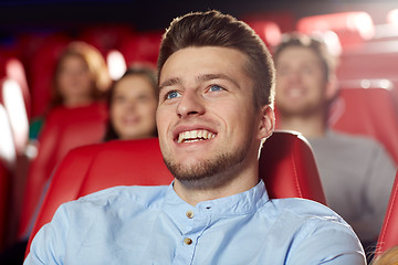 Image showing happy young man watching movie in theater