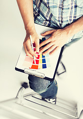 Image showing man with color samples for selection