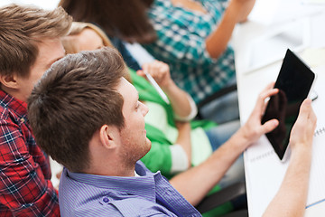 Image showing students looking at tablet pc at school