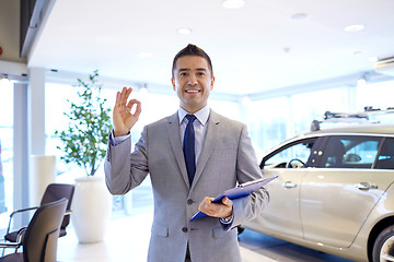 Image showing happy man at auto show or car salon