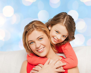 Image showing happy mother with daughter hugging and talking