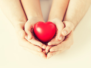 Image showing woman and man hands with heart