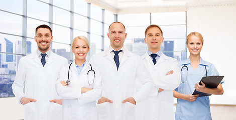 Image showing group of smiling doctors with clipboard
