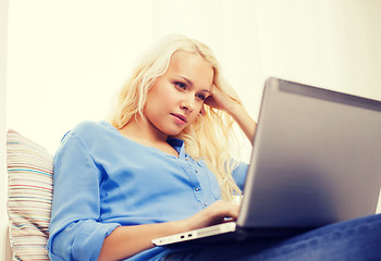 Image showing woman with laptop computer at home