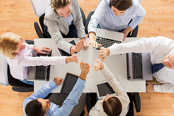 Image showing close up of business team showing high five