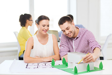 Image showing smiling architects working in office