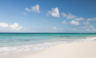 Image showing blue sea or ocean, white sand and sky with clouds