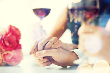 Image showing engaged couple with wine glasses