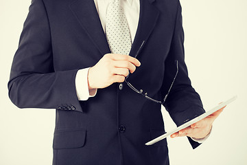 Image showing man with tablet pc and eyeglasses