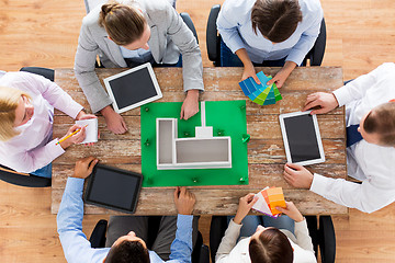 Image showing close up of business team with project layout