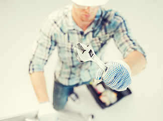 Image showing man with ladder, toolkit and spanner