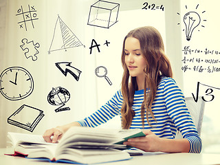 Image showing smiling student girl reading books at home