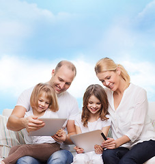 Image showing happy family with tablet pc computers